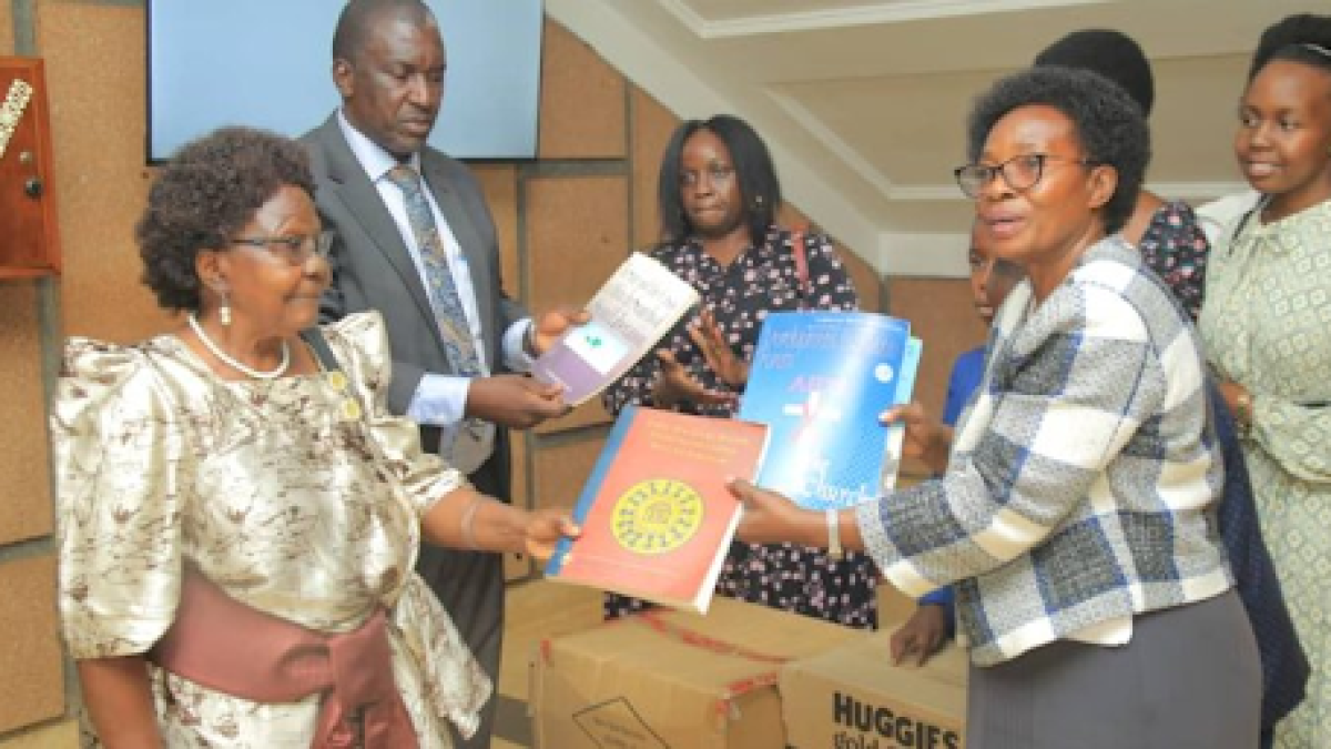 Family members hand over the books to Buganda Minister Choltilda Nakate Kikomeko. Family members hand over the books to Buganda Minister Choltilda Nakate Kikomeko.